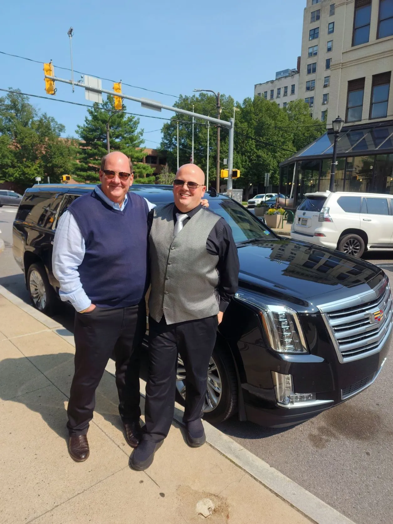 The Limo Guy chauffeurs with a black Cadillac Escalade